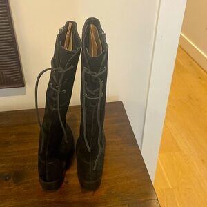 These are Born heeled boots, size 6.5, and are made of black leather.